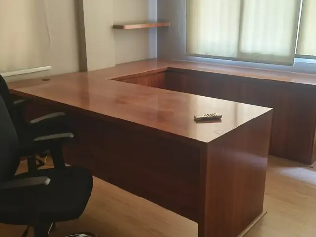 L-shaped executive desk and office chair