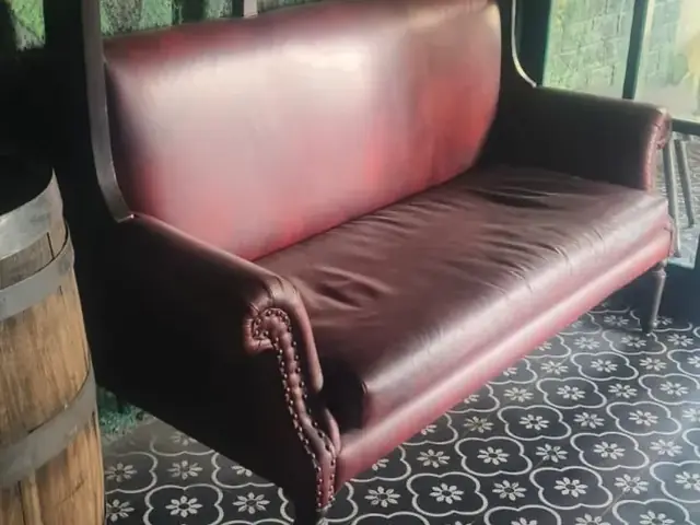Maroon leather sofa
