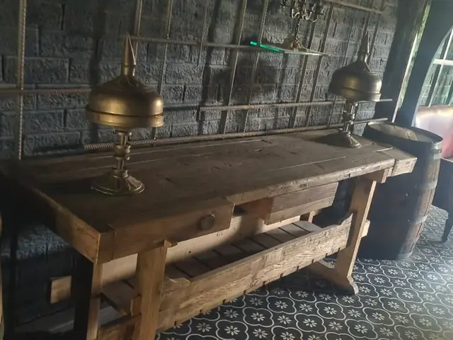 Rustic wooden console table and leather sofa