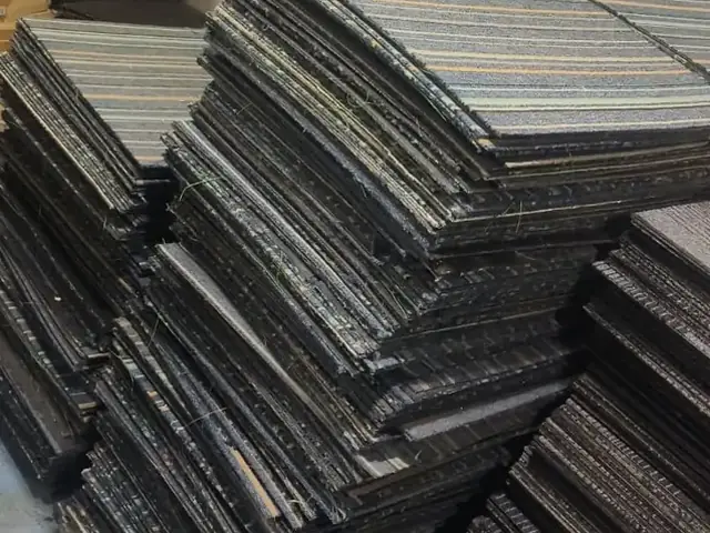 Stacks of used carpet tiles